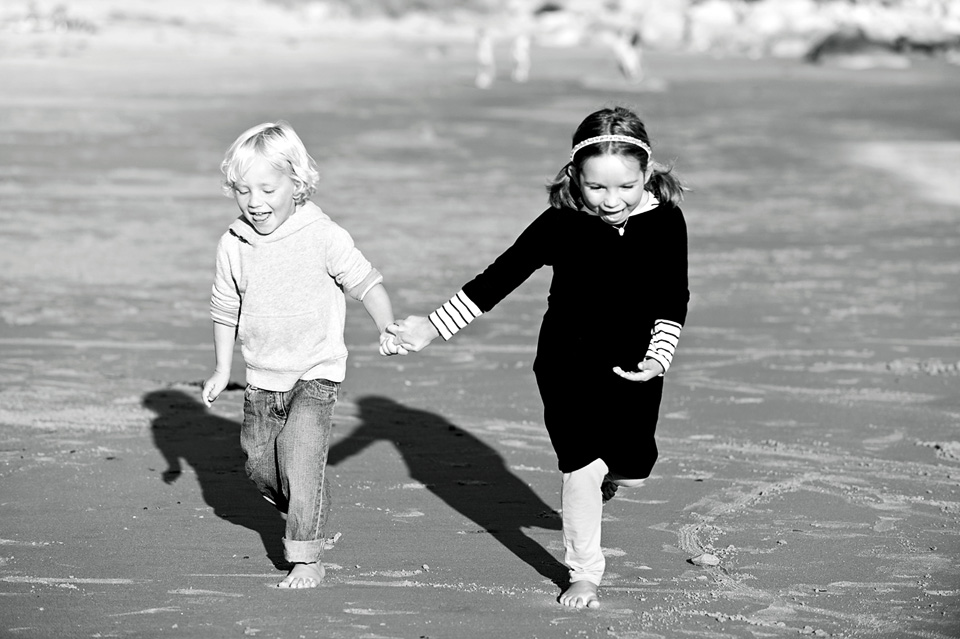Young ones running on the beach